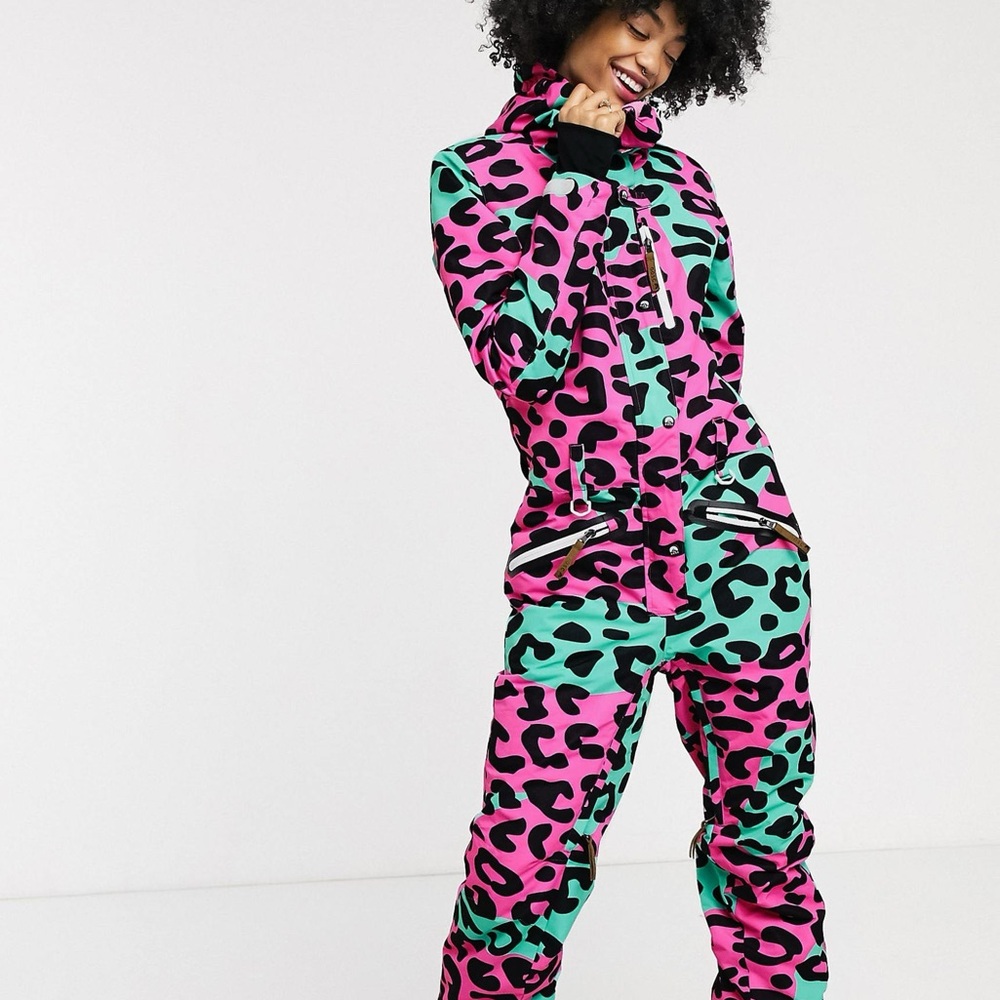Vibrant Women’s slim fit ski suit in neon pink leopard and turquoise.